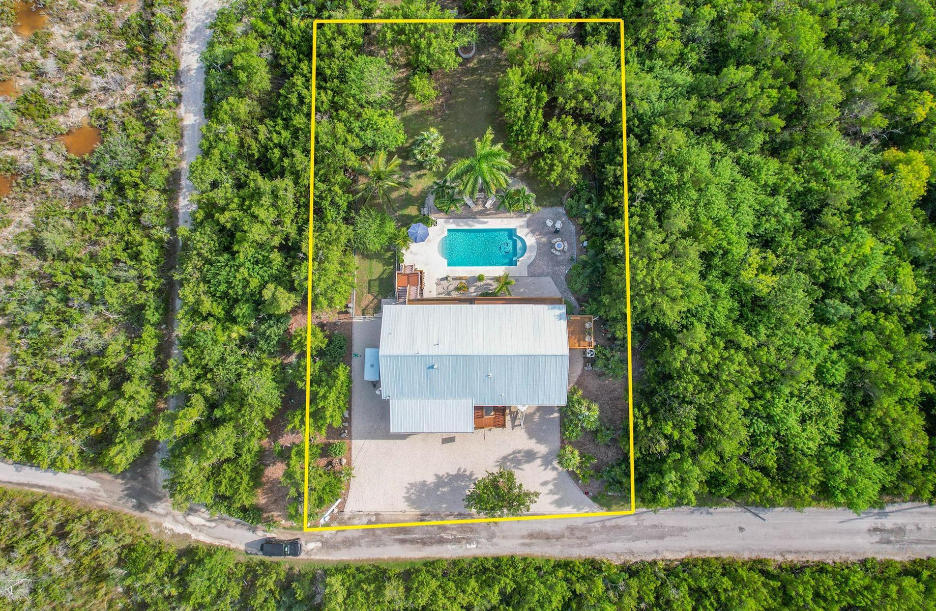 29430 Chickasaw Street Big Pine Key, FL 33043 - Photo 6 of 33 an aerial view of a house with a yard