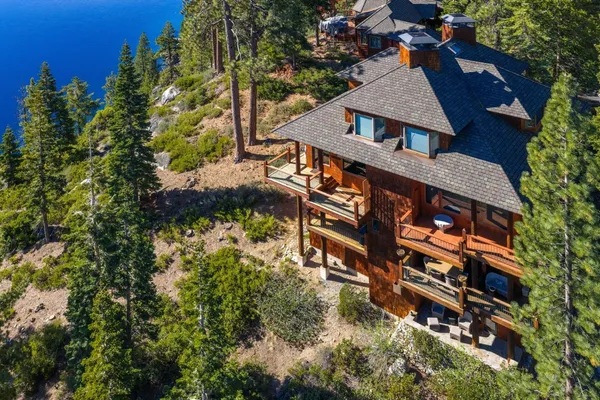 an aerial view of house with yard