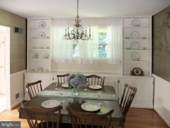 6411 Earlham Drive Bethesda, MD 20817 - Photo 5 of 16 a view of a dining room with furniture and chandelier