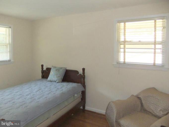 6411 Earlham Drive Bethesda, MD 20817 - Photo 9 of 16 a bedroom with a bed and a window