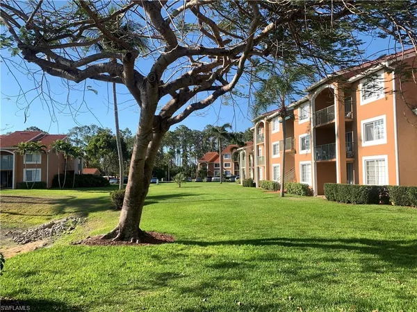 a view of a big yard next to a house