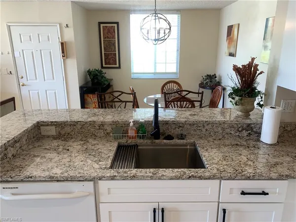 a kitchen with sink and window