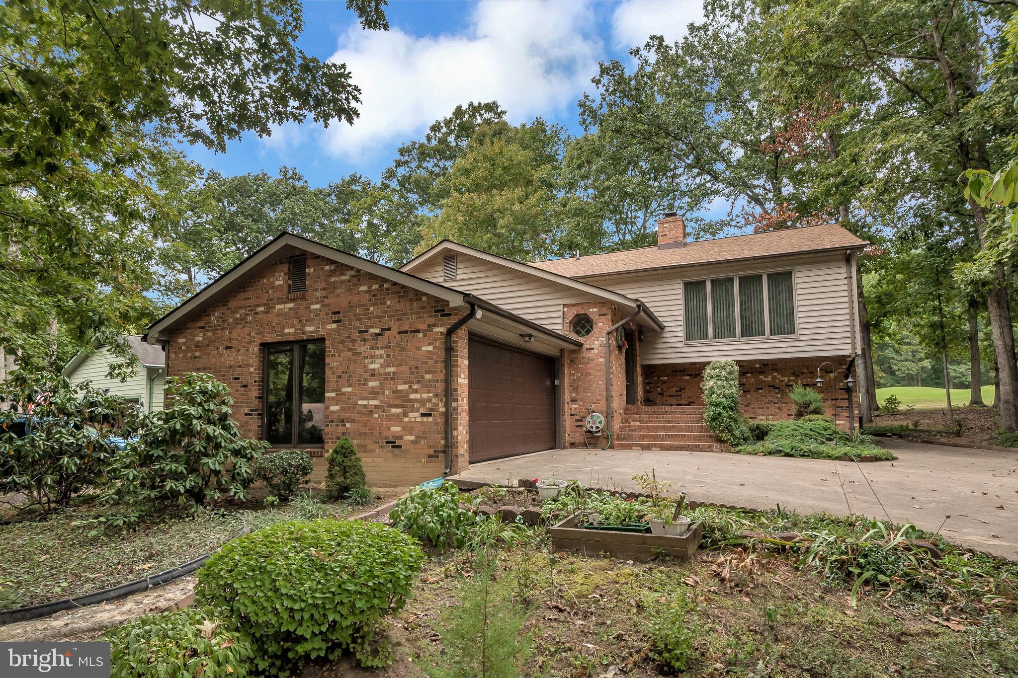 506 Birdie Road Locust Grove, VA 22508 - Photo 2 of 35 Spacious driveway and side loading garage