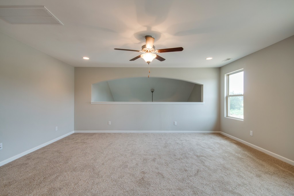 938 Hunters Lane Springfield, TN 37172 - Photo 22 of 29 an empty room with windows and chandelier fan