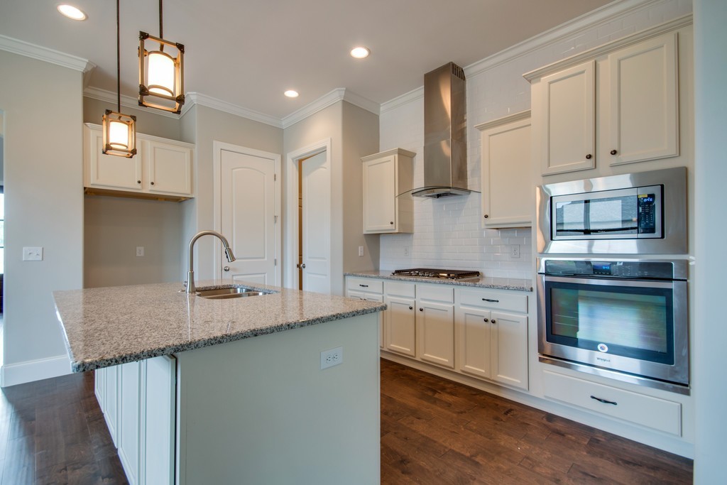 938 Hunters Lane Springfield, TN 37172 - Photo 8 of 29 a kitchen with stainless steel appliances granite countertop a sink a stove and cabinets