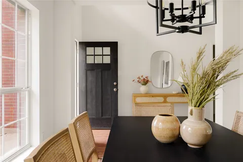 a view of dining room and hall with wooden floor