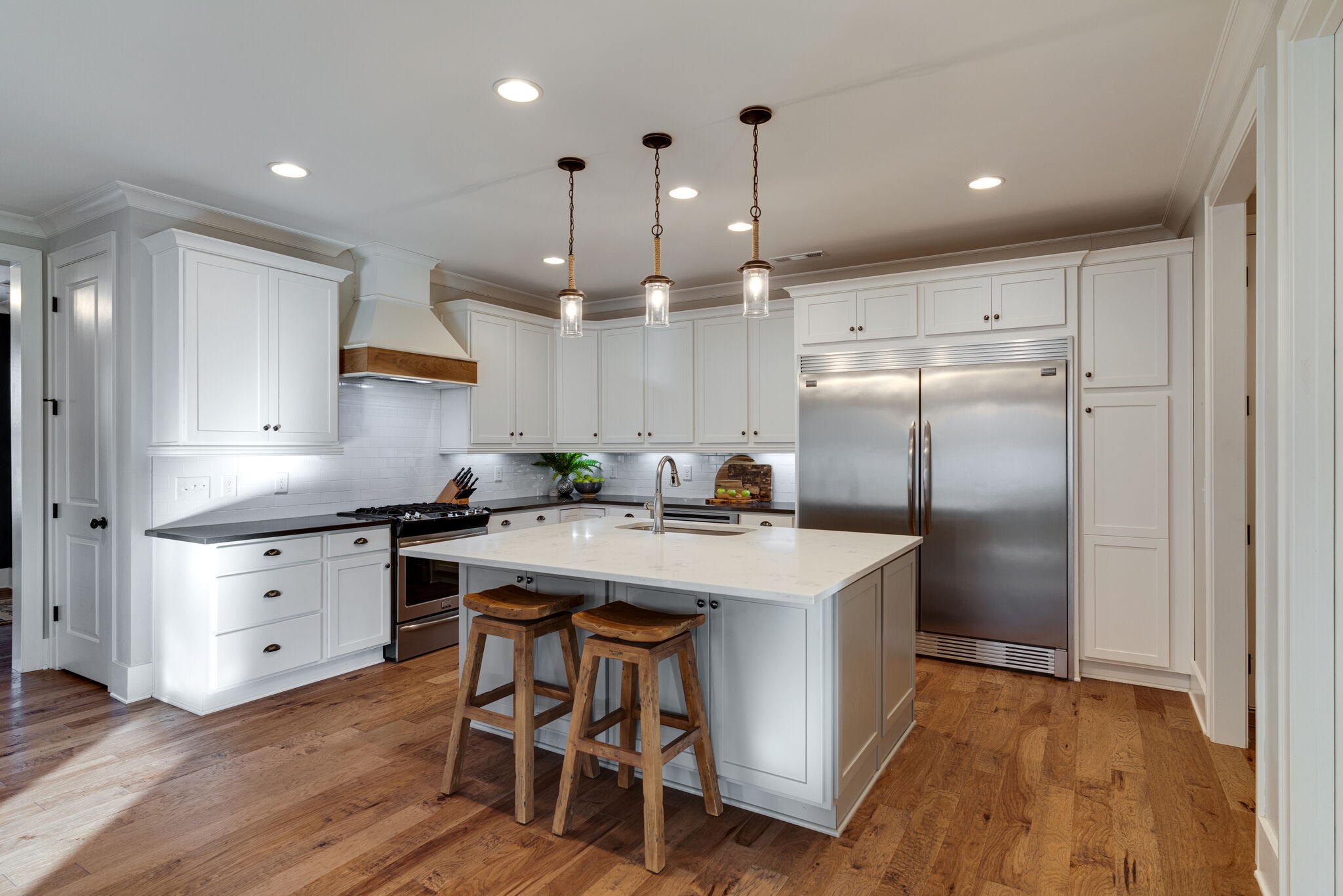 136 Vanner Road Mount Juliet, TN 37122 - Photo 11 of 55 a kitchen with kitchen island a sink stove and refrigerator