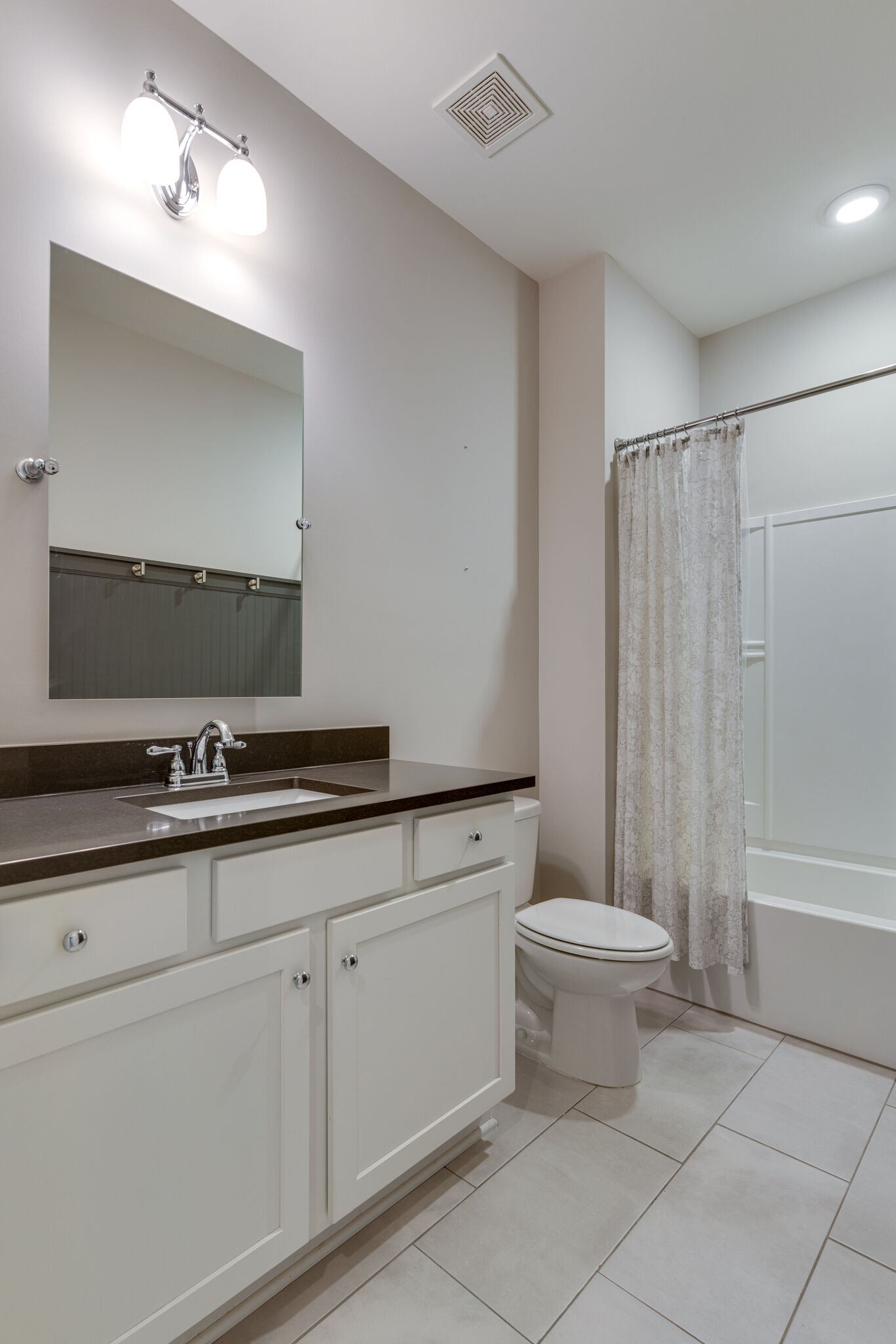 136 Vanner Road Mount Juliet, TN 37122 - Photo 27 of 55 a bathroom with a toilet a sink a mirror and a bathtub