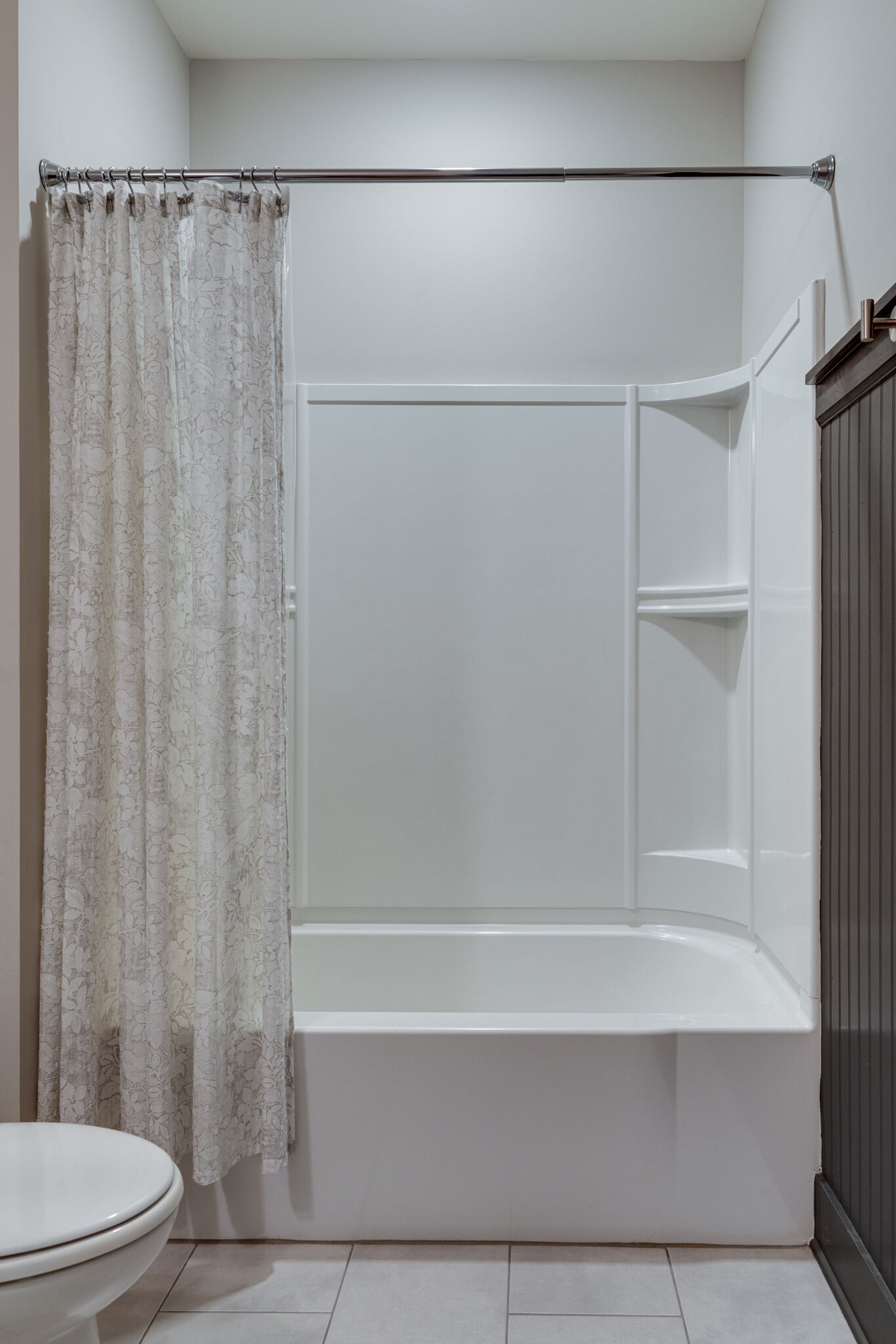 136 Vanner Road Mount Juliet, TN 37122 - Photo 28 of 55 a bathroom with a shower curtain and a toilet
