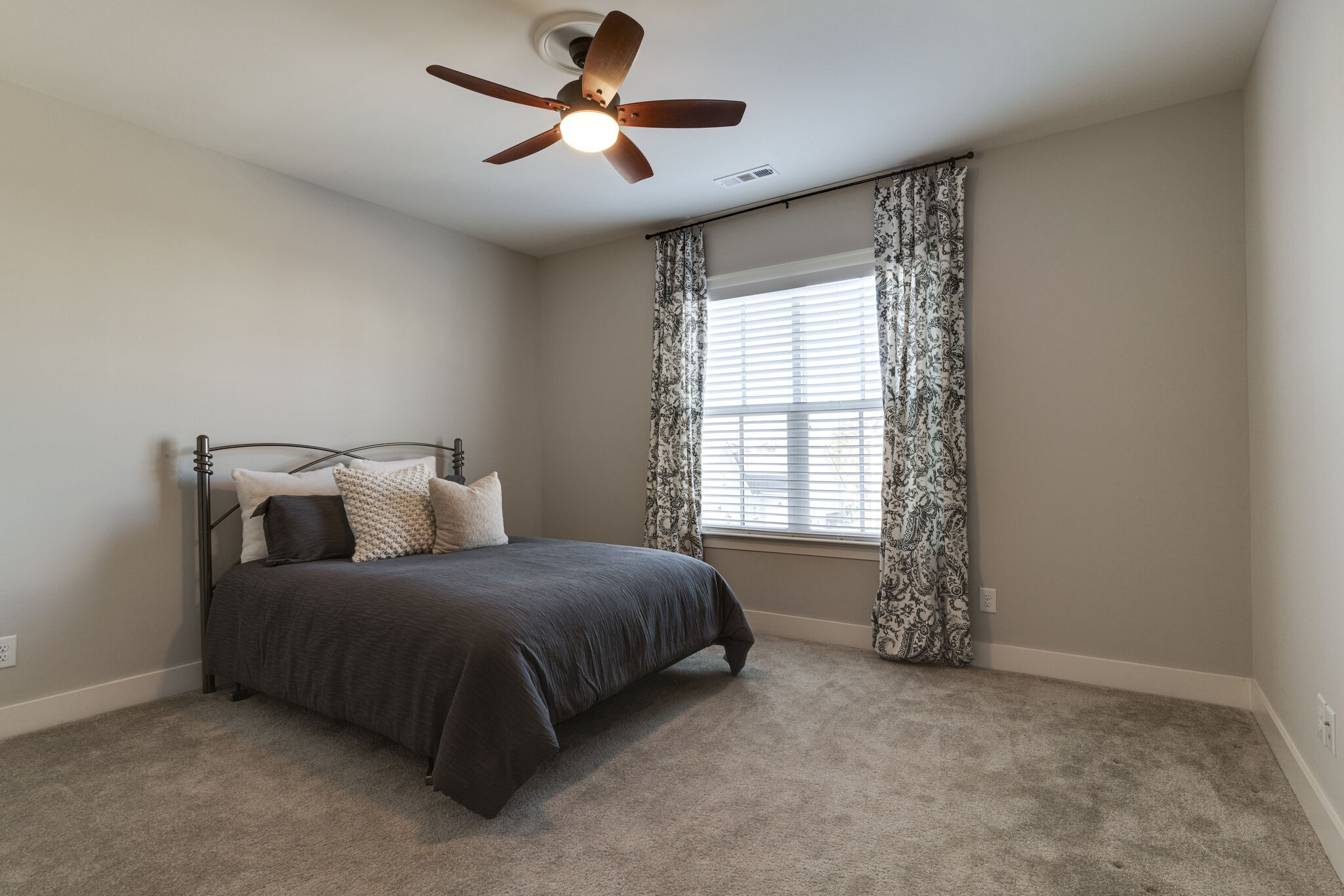 136 Vanner Road Mount Juliet, TN 37122 - Photo 29 of 55 a bedroom with a bed and a chandelier