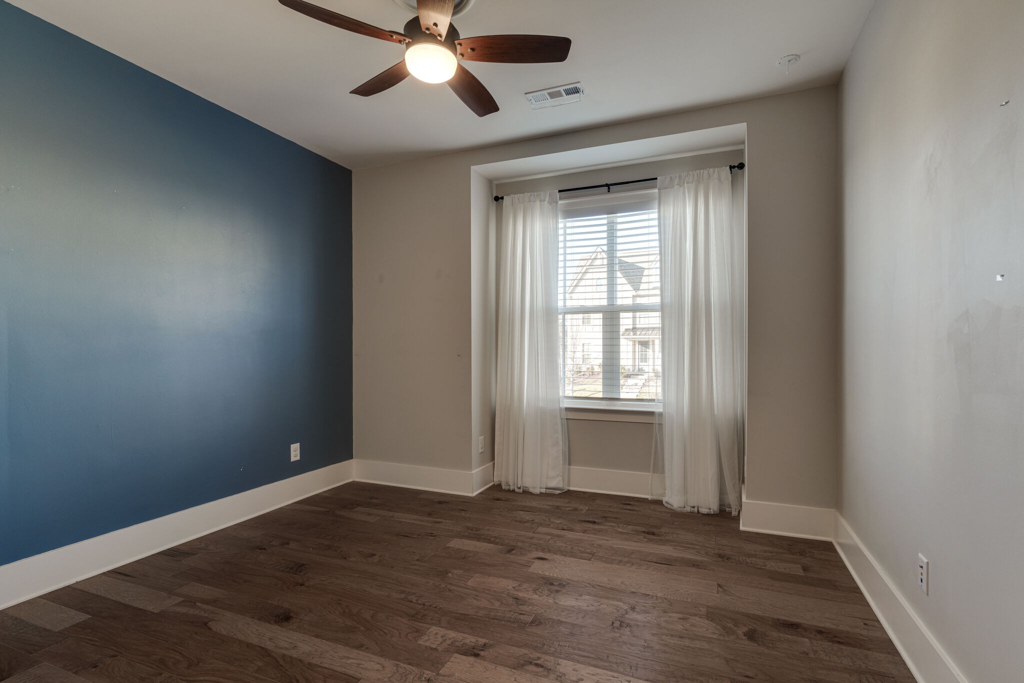 136 Vanner Road Mount Juliet, TN 37122 - Photo 33 of 55 a view of an empty room with wooden floor and a window