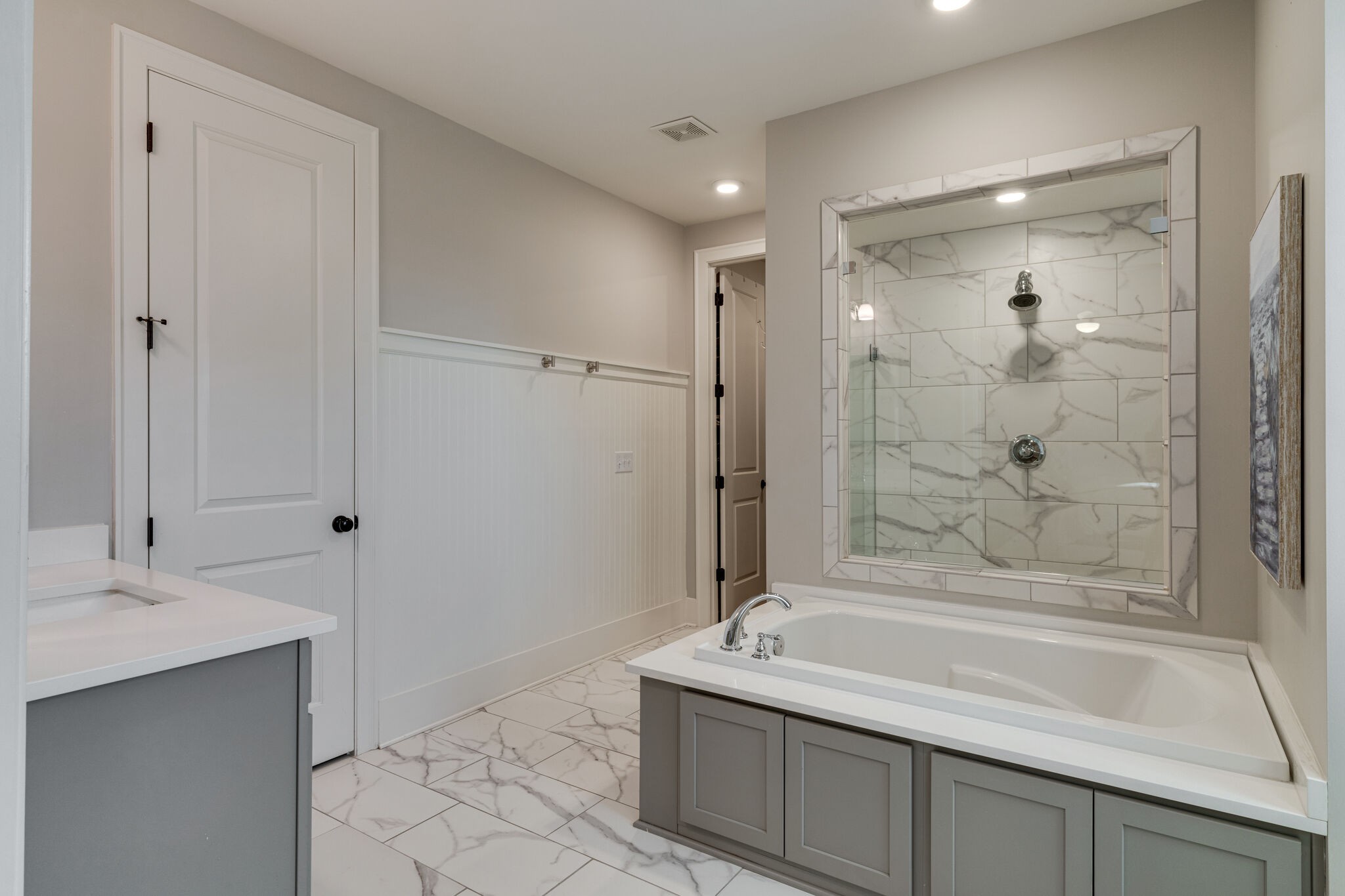 136 Vanner Road Mount Juliet, TN 37122 - Photo 38 of 55 a bathroom with a granite countertop sink a mirror and a bathtub