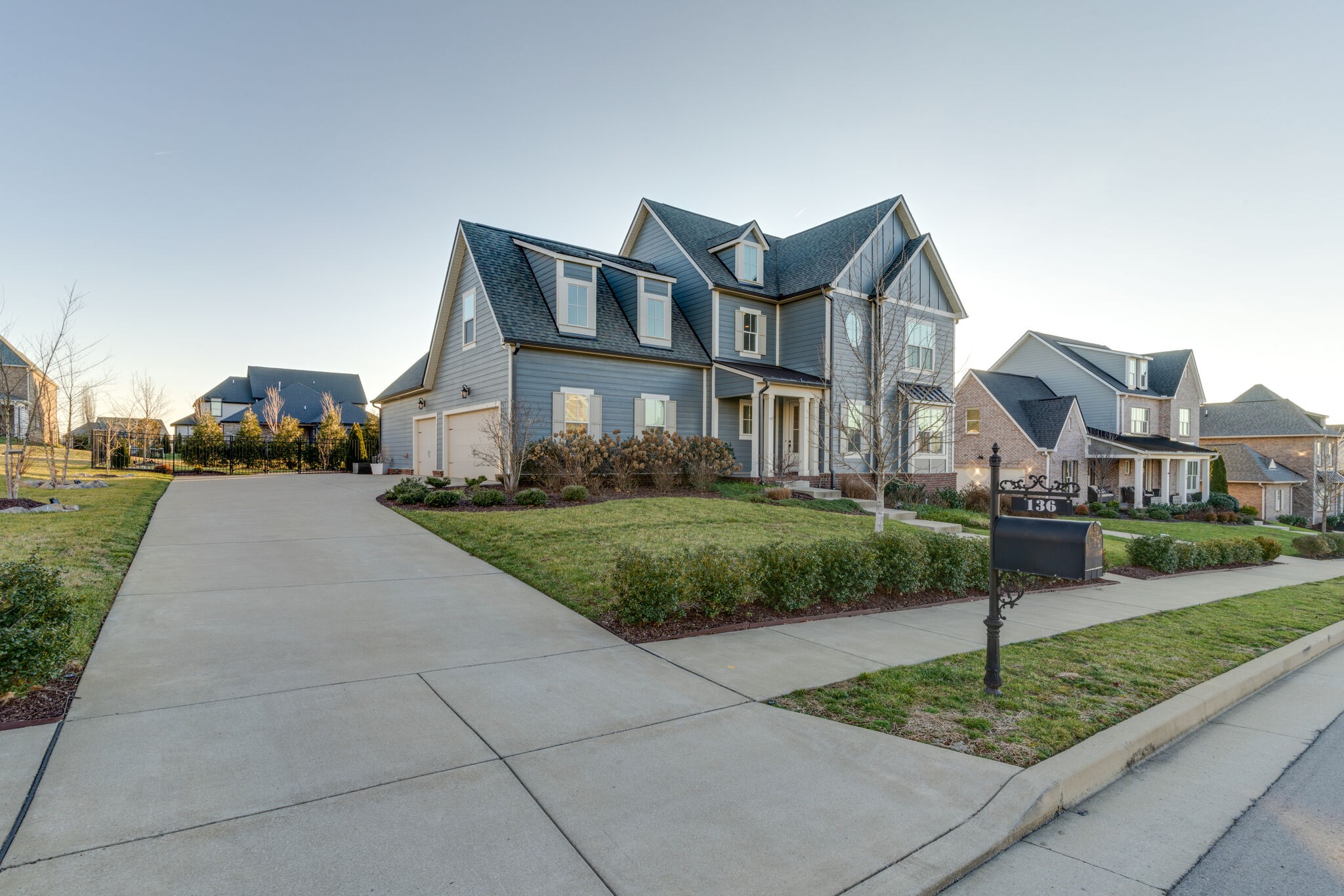 136 Vanner Road Mount Juliet, TN 37122 - Photo 4 of 55 a front view of a house with a yard and potted plants