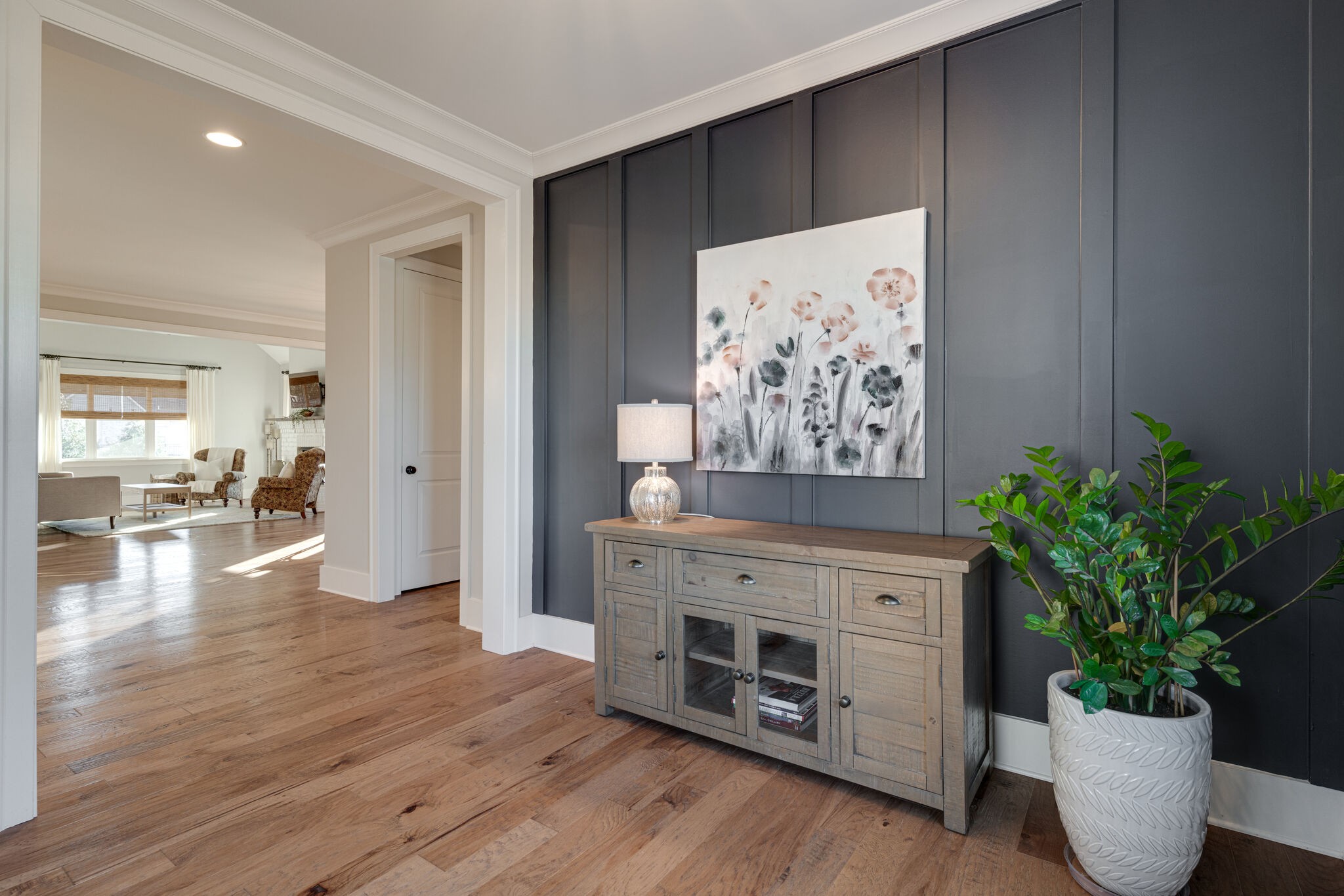 136 Vanner Road Mount Juliet, TN 37122 - Photo 8 of 55 a view of a hallway with wooden floor and a potted plant