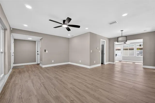a kitchen with refrigerator a sink and cabinets