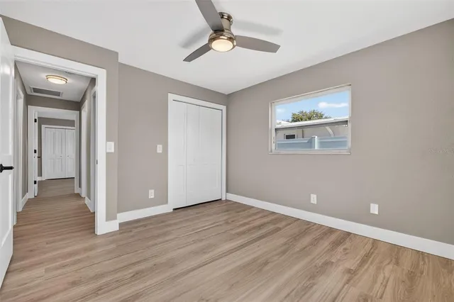 a view of house with a backyard