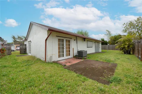 a view of a backyard of the house