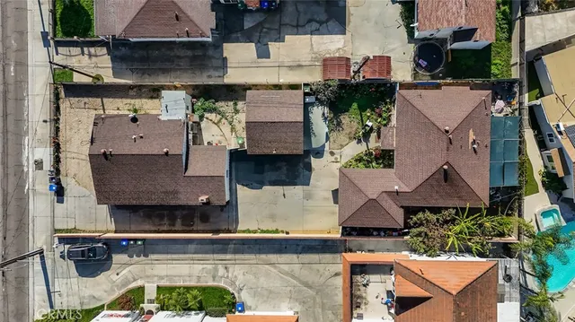 an aerial view of residential houses with outdoor space