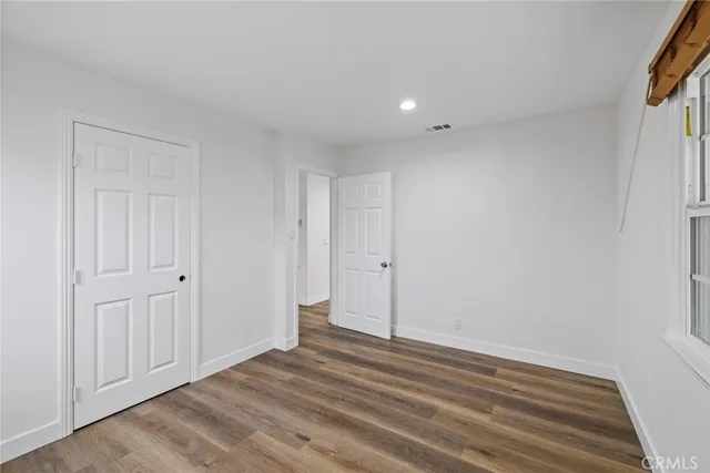 a view of a livingroom with wooden floor