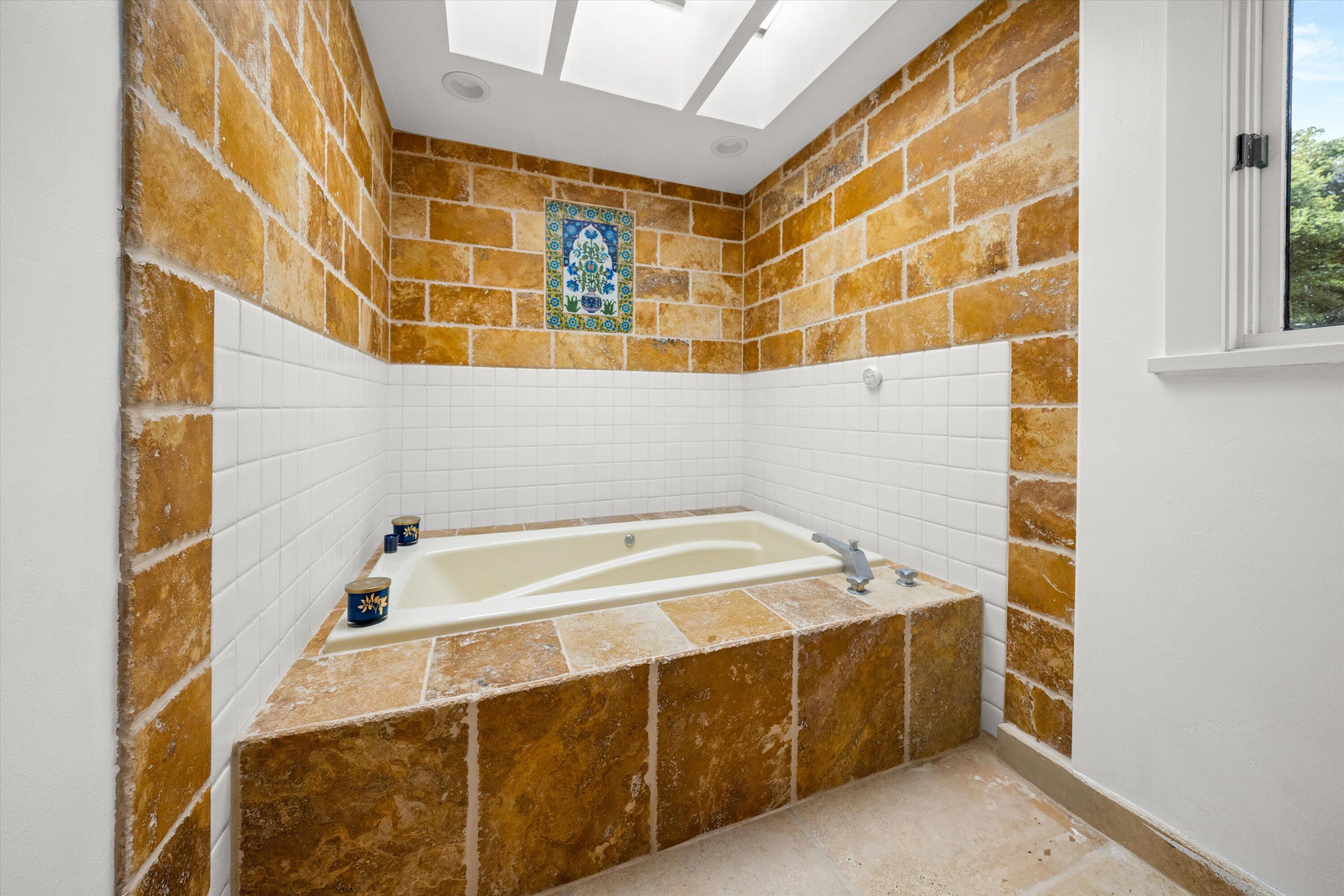 1435 Sycamore Canyon Road Santa Barbara, CA 93108 - Photo 21 of 49 a bathroom with a tub and a sink