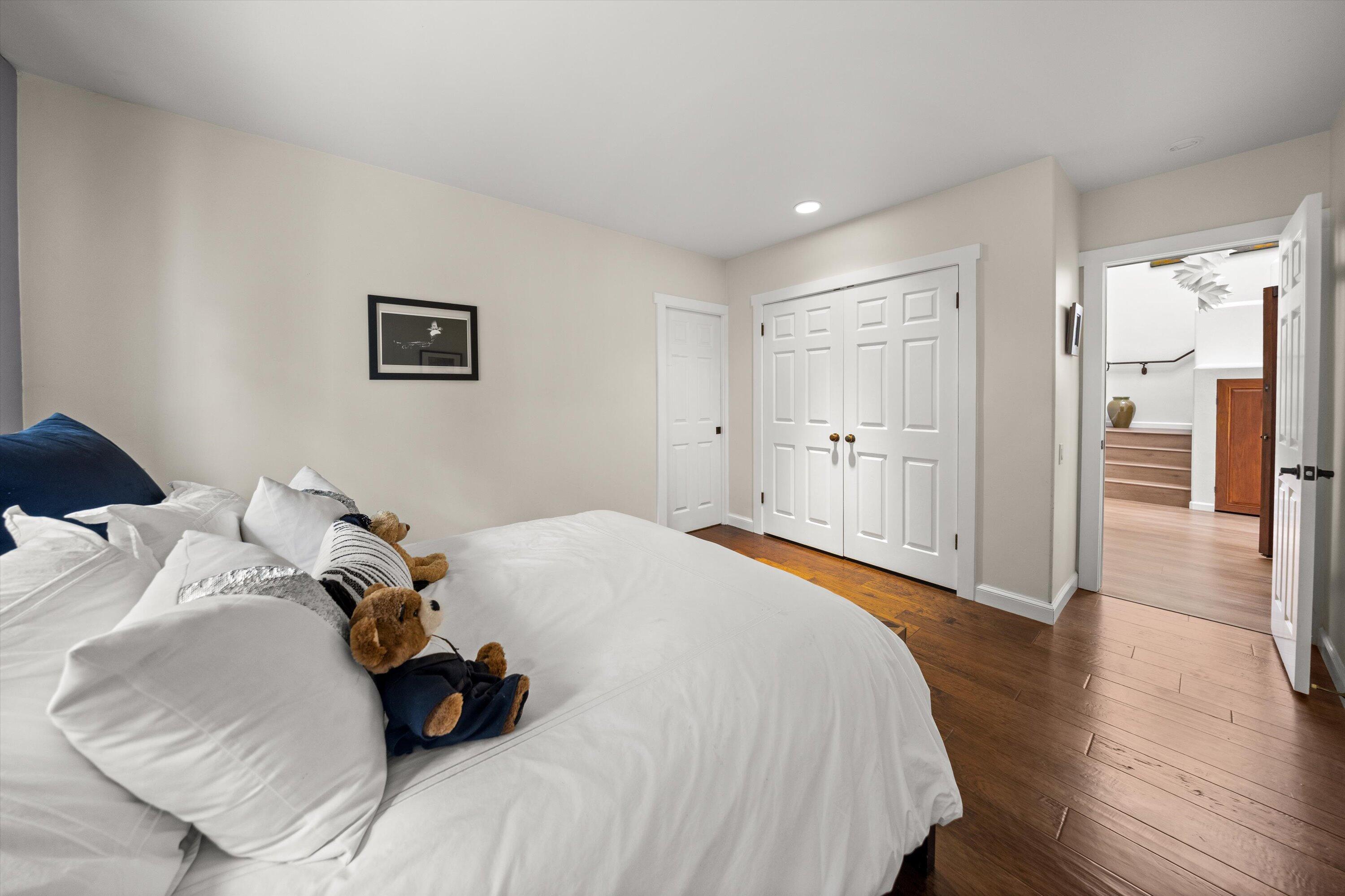 1435 Sycamore Canyon Road Santa Barbara, CA 93108 - Photo 23 of 49 a spacious bedroom with a bed and wooden floor