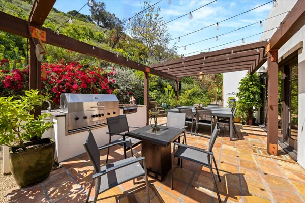 a view of a backyard with sitting area