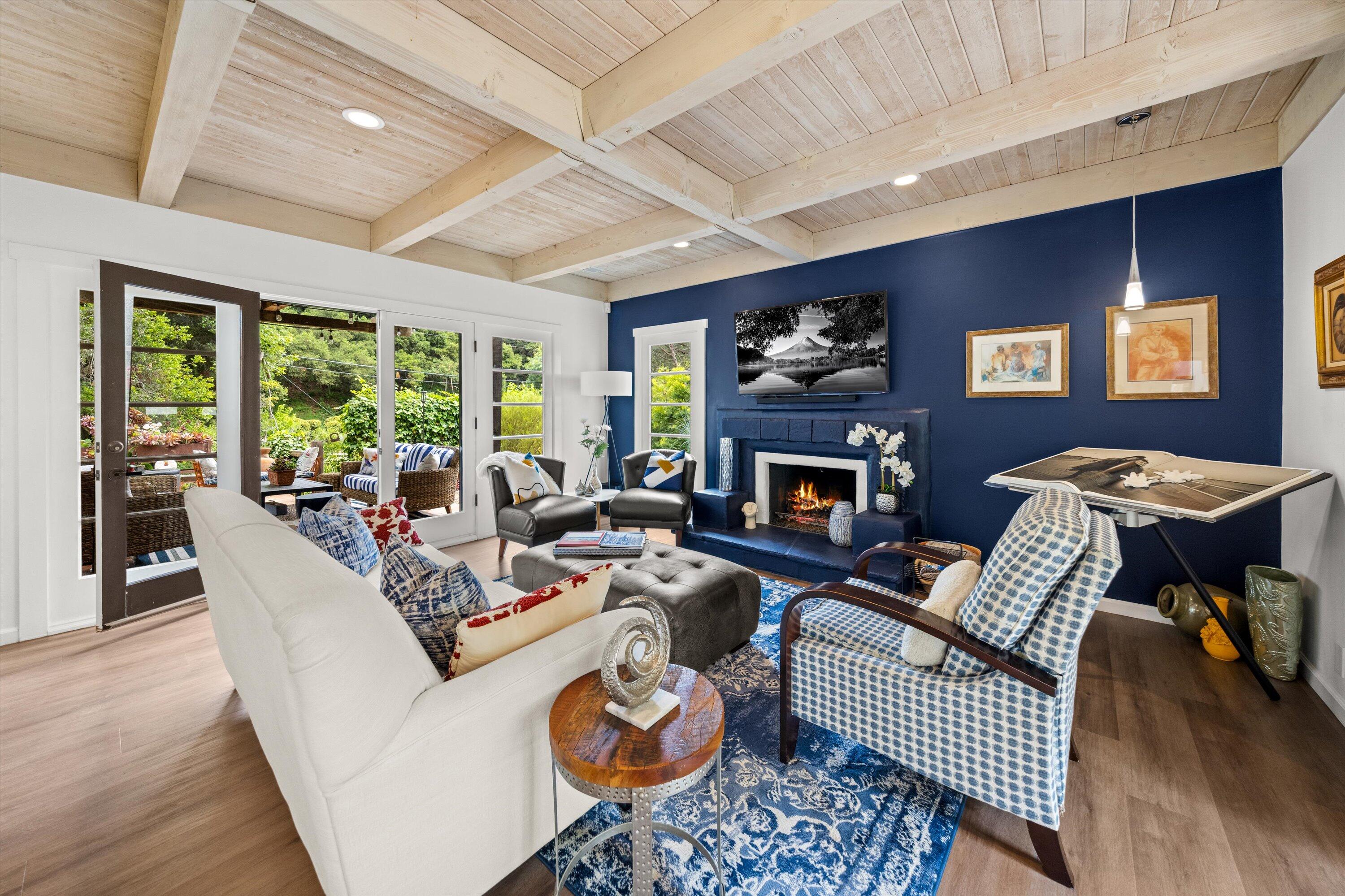 1435 Sycamore Canyon Road Santa Barbara, CA 93108 - Photo 4 of 49 a living room with furniture fireplace and a large window