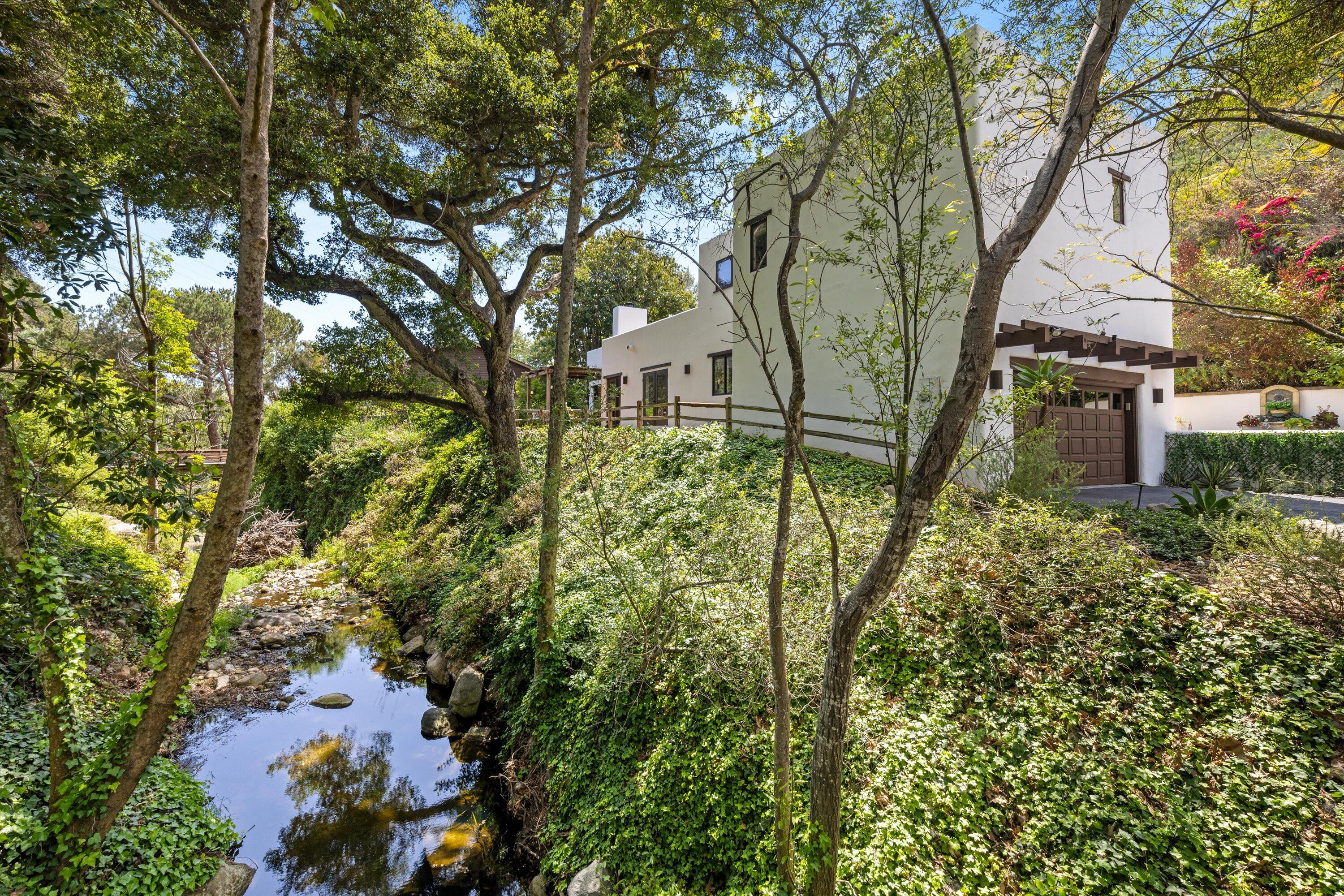 1435 Sycamore Canyon Road Santa Barbara, CA 93108 - Photo 41 of 49 a backyard of a house with table and chairs