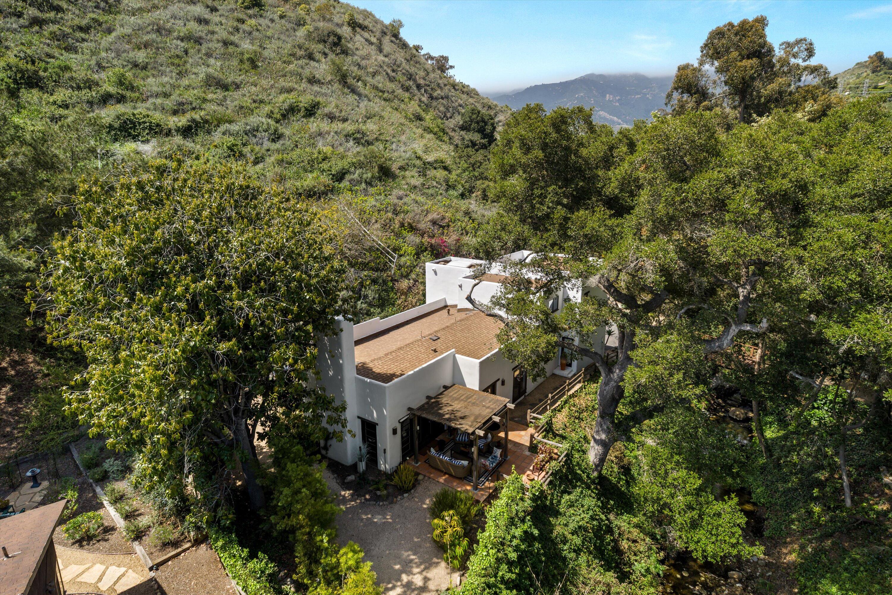 1435 Sycamore Canyon Road Santa Barbara, CA 93108 - Photo 43 of 49 an aerial view of a house with a yard and garden