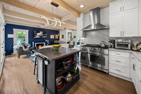 a kitchen with a stove and a refrigerator