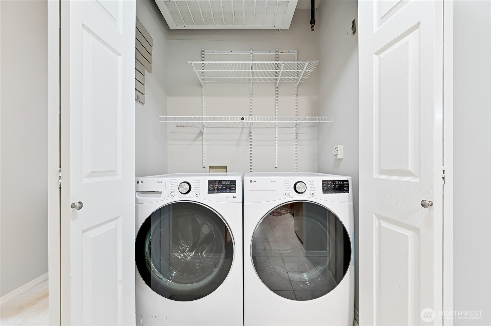 12109 Northeast 171st Place, Unit B103 Bothell, WA 98011 - Photo 19 of 39 a utility room with dryer and washer