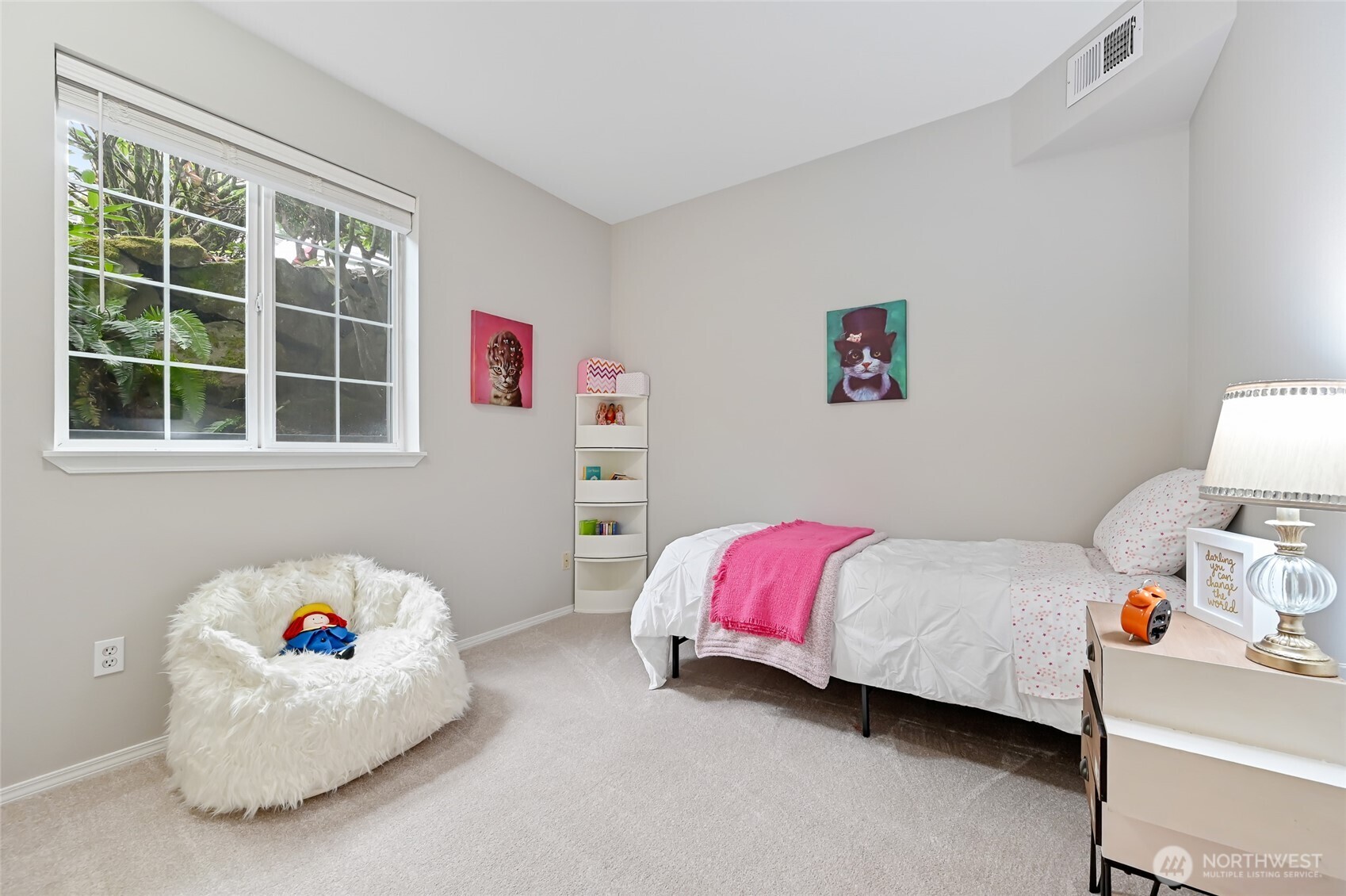 12109 Northeast 171st Place, Unit B103 Bothell, WA 98011 - Photo 20 of 39 a bedroom with a bed and a window