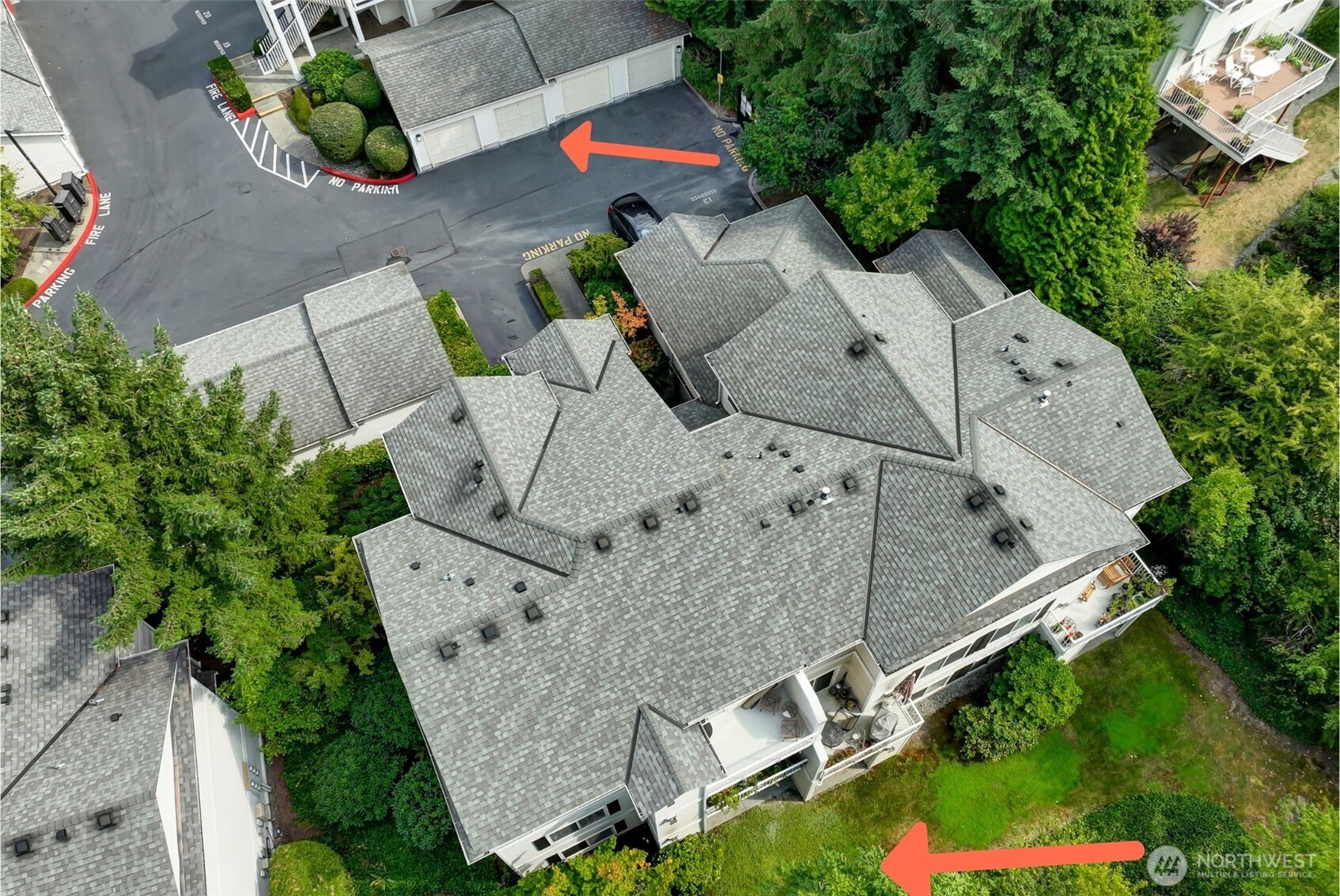 12109 Northeast 171st Place, Unit B103 Bothell, WA 98011 - Photo 33 of 39 an aerial view of multiple houses with yard