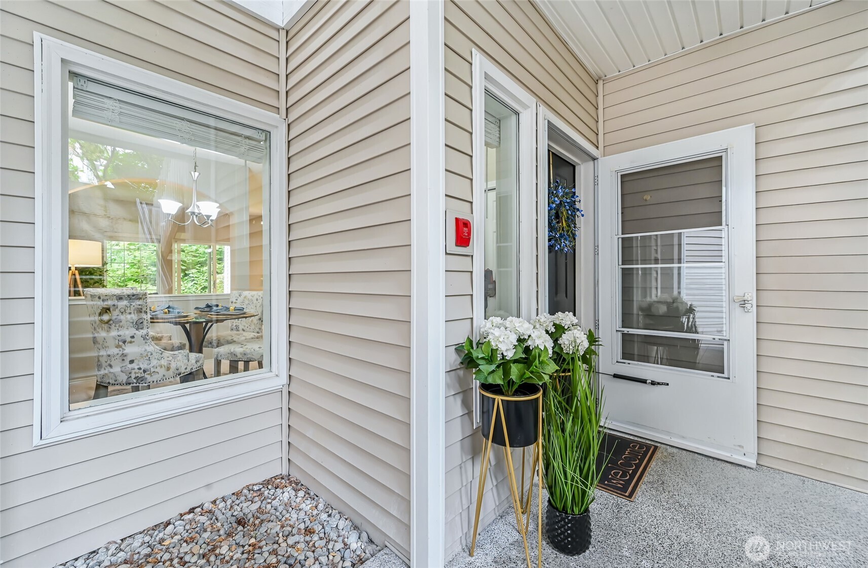 12109 Northeast 171st Place, Unit B103 Bothell, WA 98011 - Photo 4 of 39 a potted plant sitting in front of a door