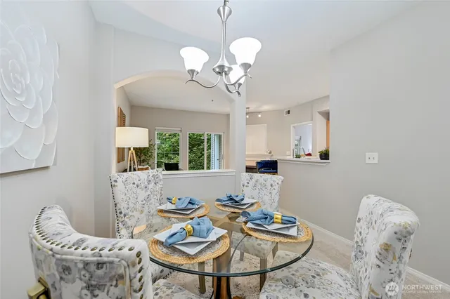 a view of a dining room with furniture window and outside view