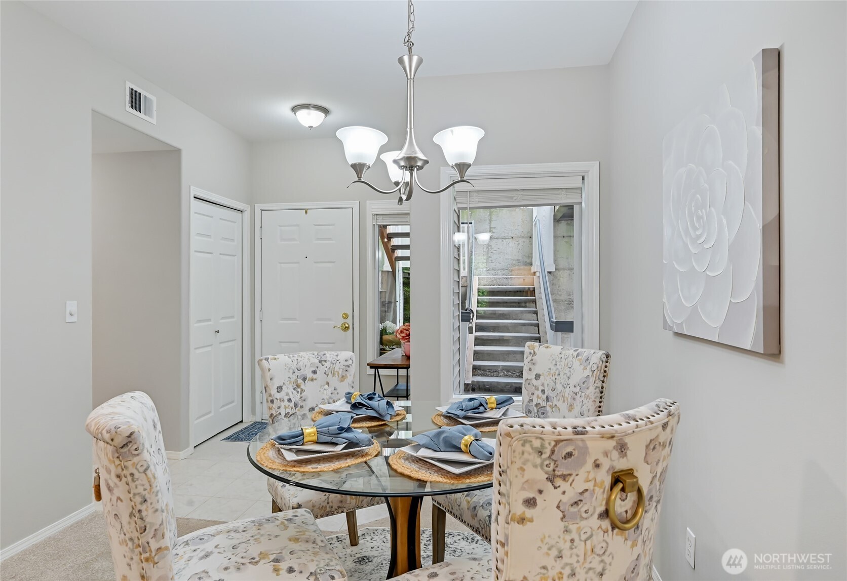 12109 Northeast 171st Place, Unit B103 Bothell, WA 98011 - Photo 8 of 39 a view of a dining room with furniture and chandelier