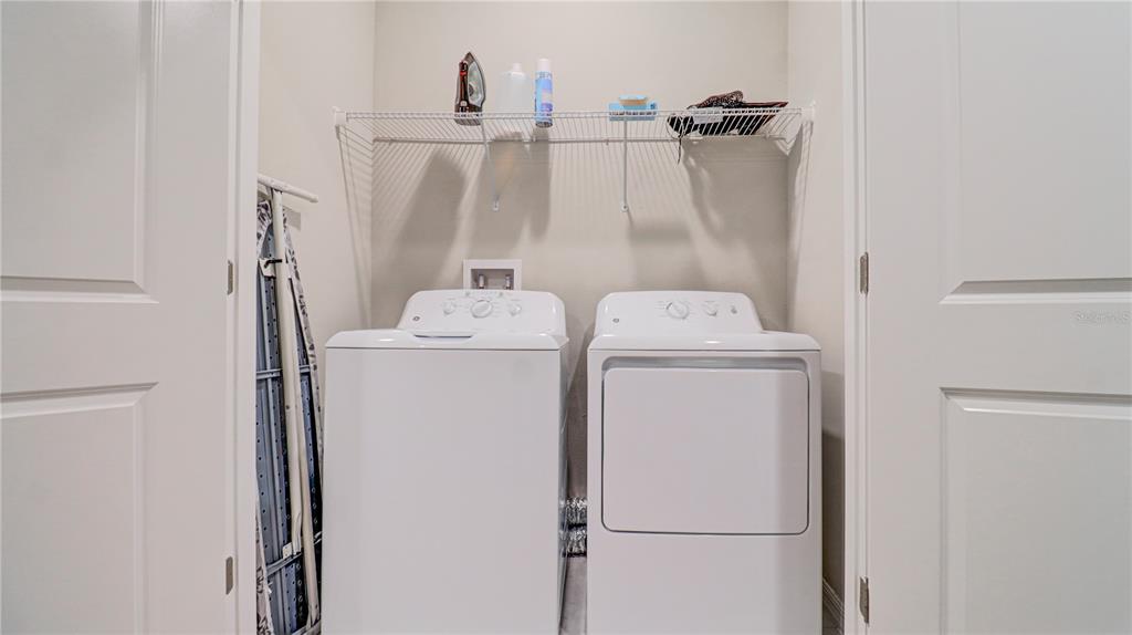 31632 Blue Passing Loop Wesley Chapel, FL 33545 - Photo 45 of 48 a utility room with dryer and washer