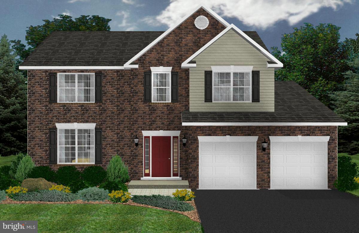 116 MacKenzie Court Huntingtown, MD 20639 - Photo 3 of 28 a front view of a house with a yard and garage