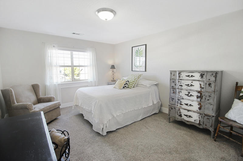 893 Ridgeview Drive Eagle Point, OR 97524 - Photo 33 of 49 a bedroom with a bed a couch and windows