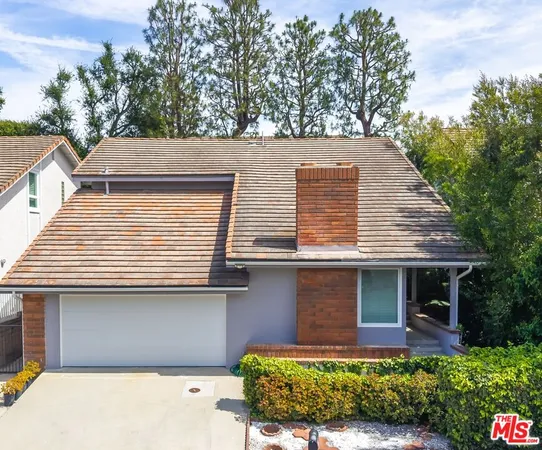 a view of outdoor space with a garden and signage