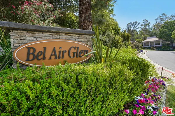 a view of outdoor space with a garden and signage