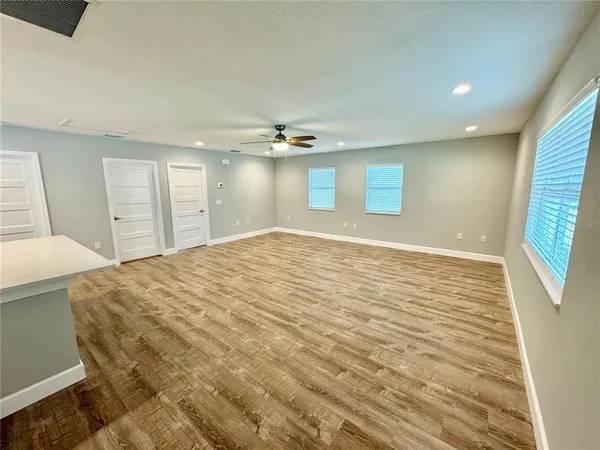 a view of an empty room with a window