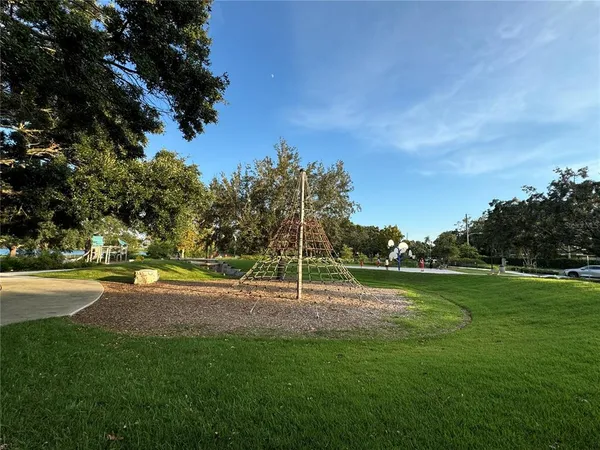 a kitchen with stainless steel appliances a stove microwave and refrigerator
