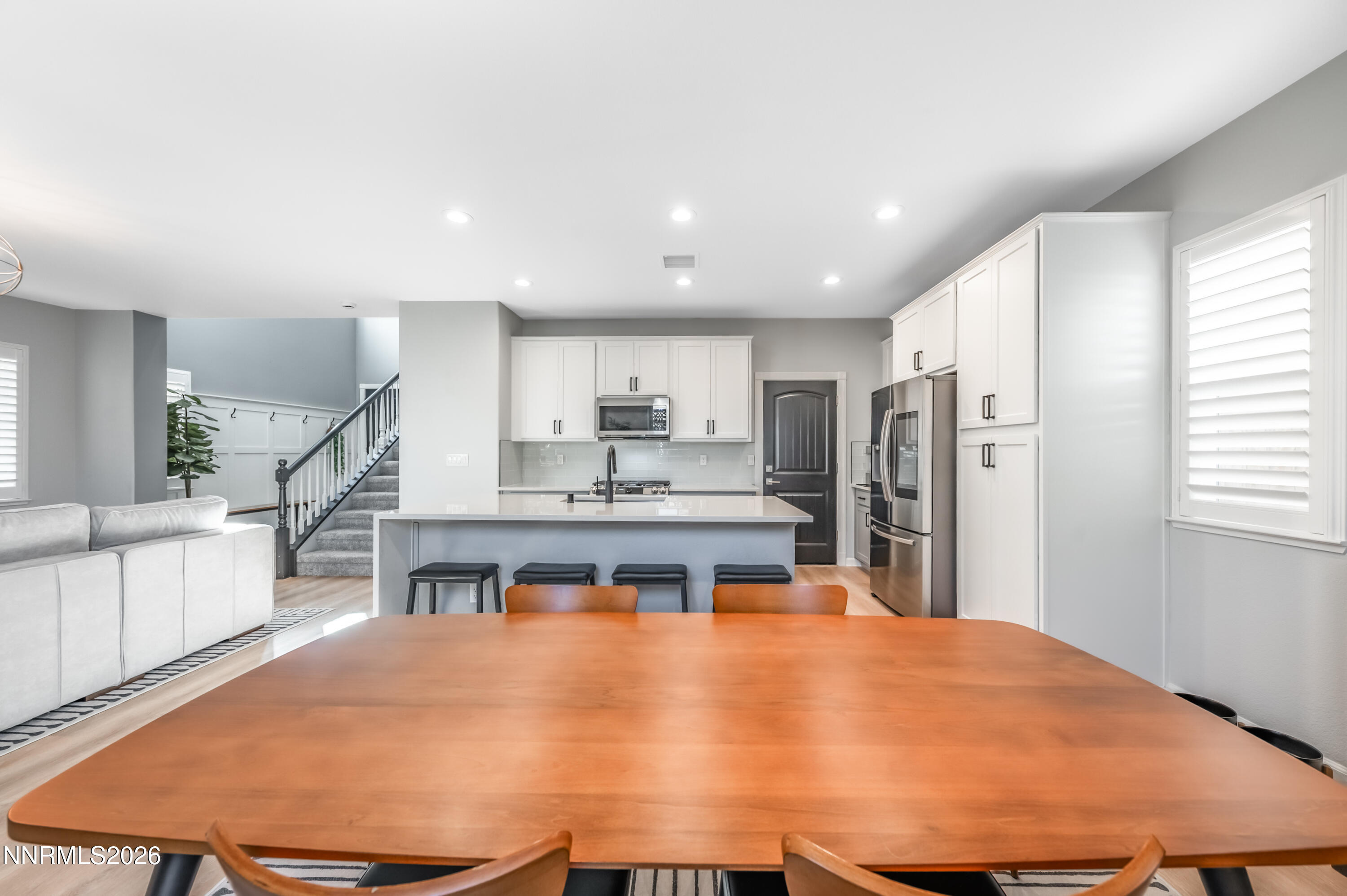 9530 Vikingholm Road Reno, NV 89521 - Photo 16 of 42 a large kitchen with a table and chairs