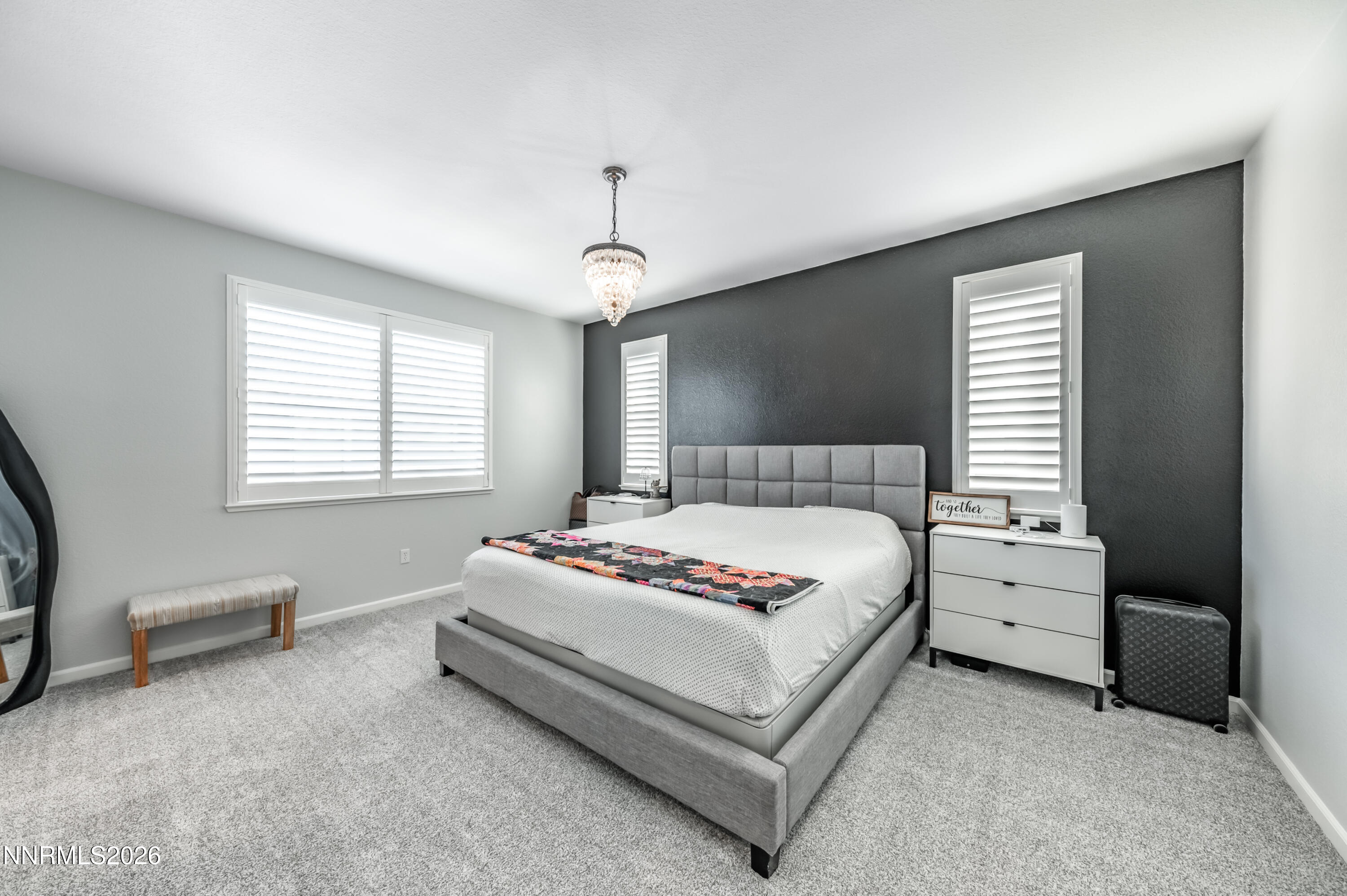 9530 Vikingholm Road Reno, NV 89521 - Photo 19 of 42 a spacious bedroom with a bed and a window