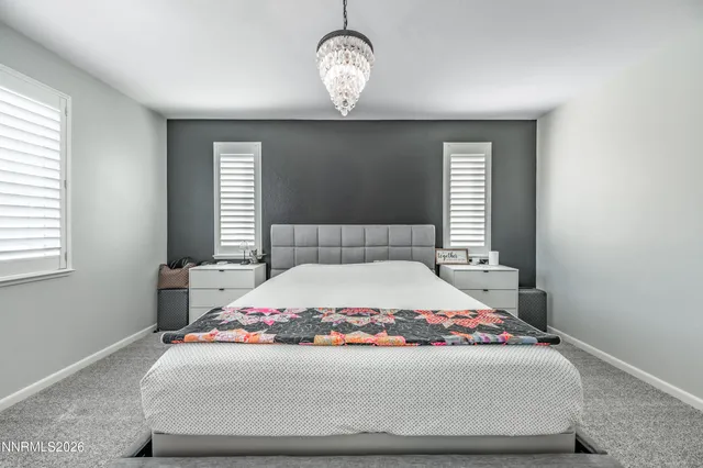 a room with a bed and window