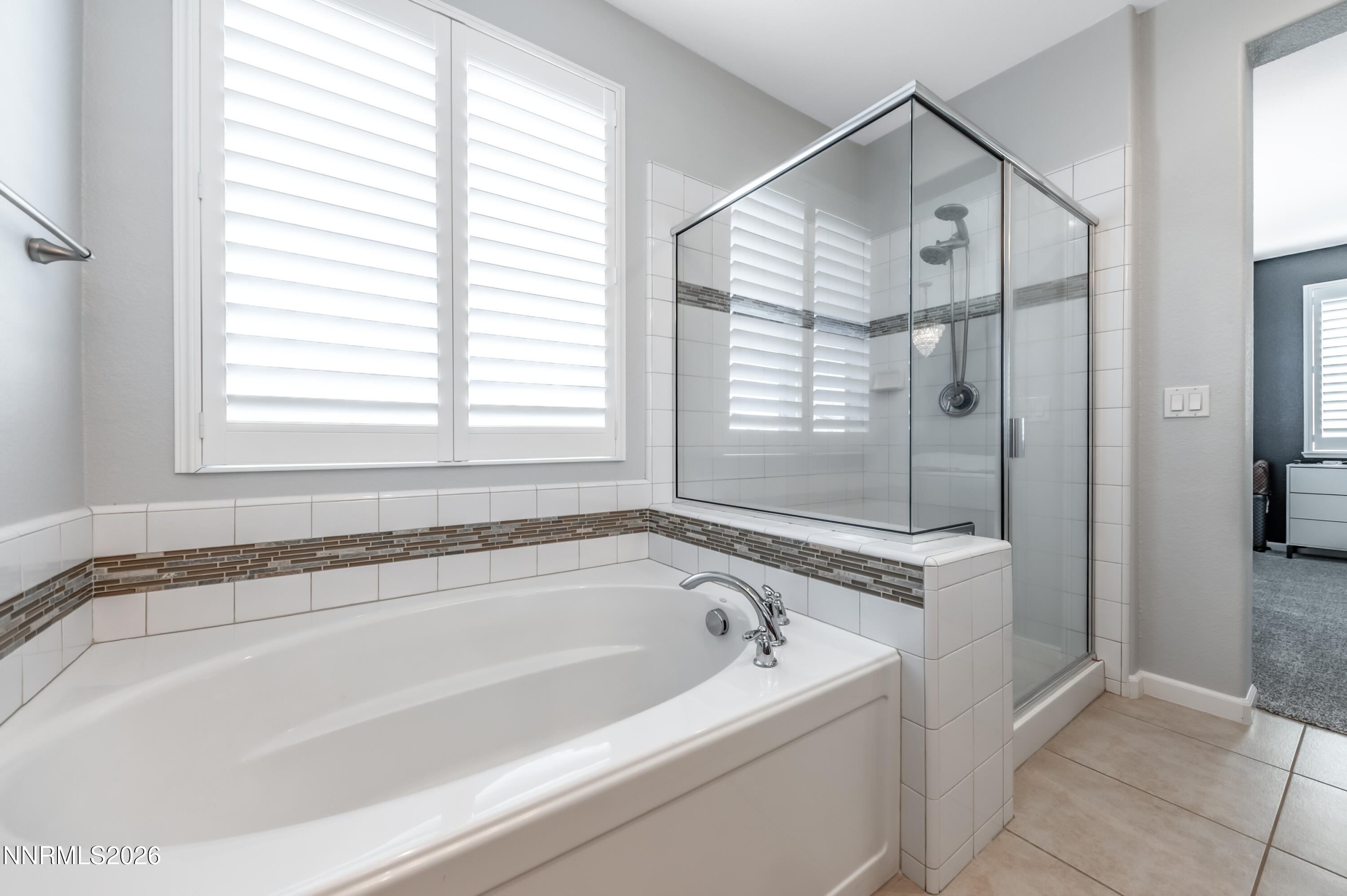 9530 Vikingholm Road Reno, NV 89521 - Photo 24 of 42 a white bath tub sitting next to a shower