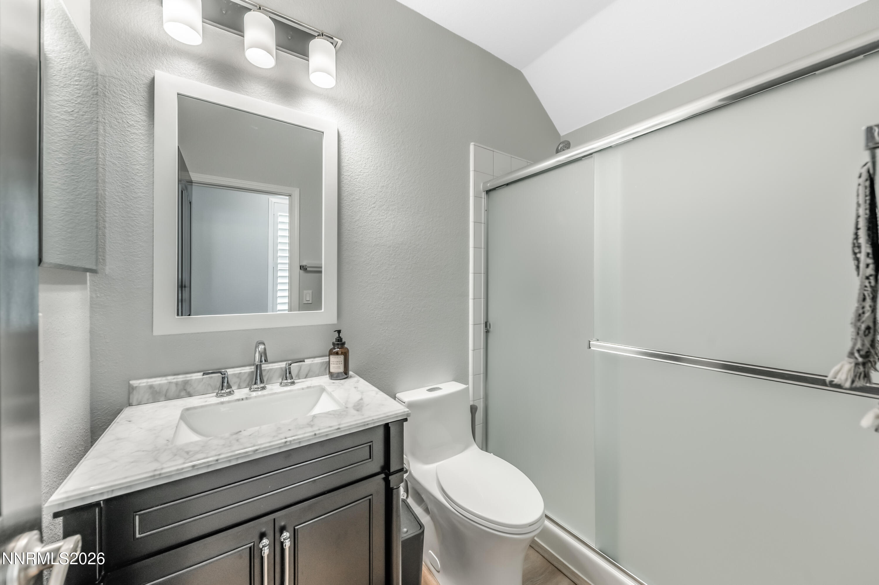 9530 Vikingholm Road Reno, NV 89521 - Photo 26 of 42 a bathroom with a granite countertop sink toilet and shower
