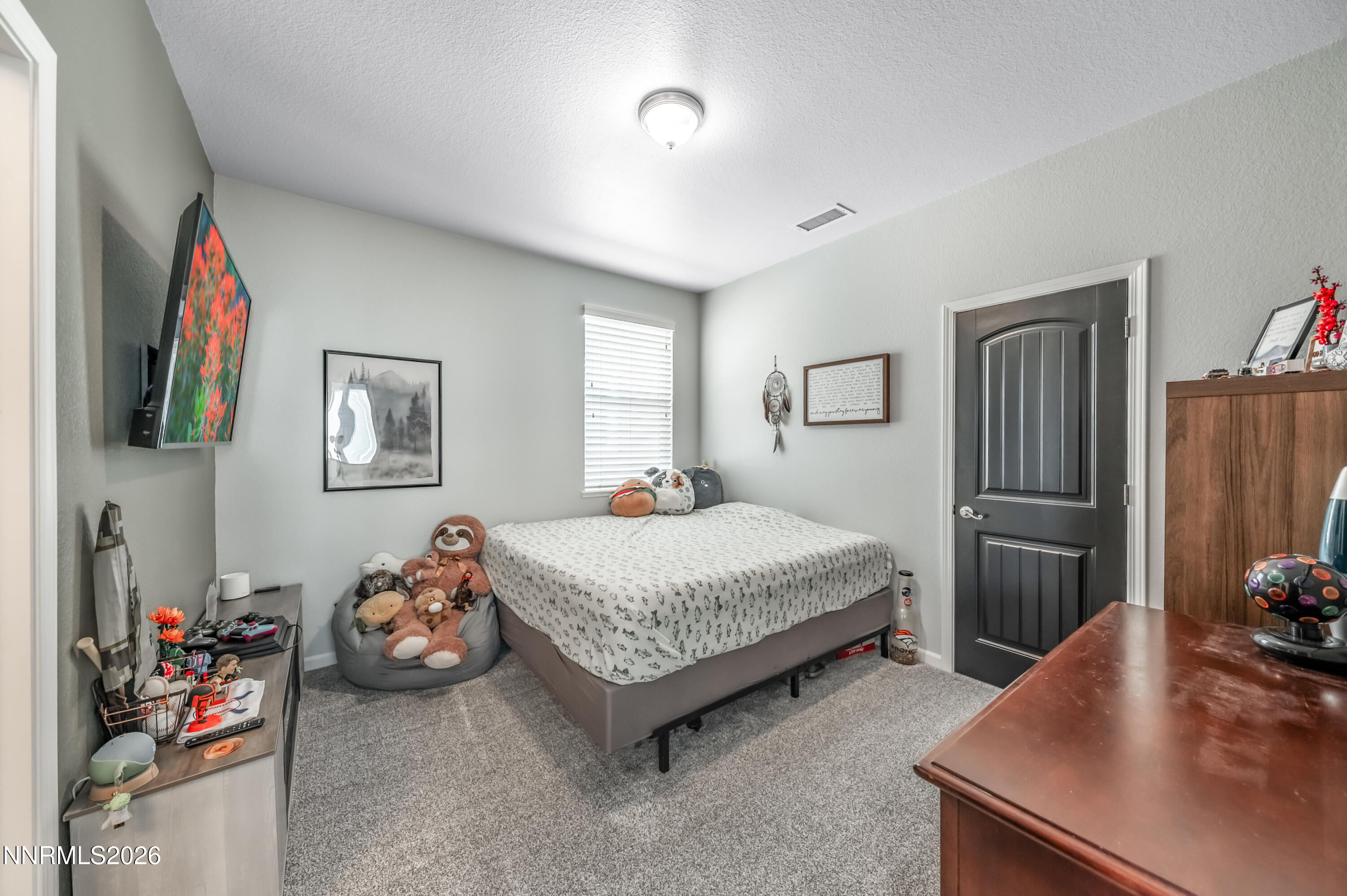 9530 Vikingholm Road Reno, NV 89521 - Photo 27 of 42 a bedroom with a bed and a dresser