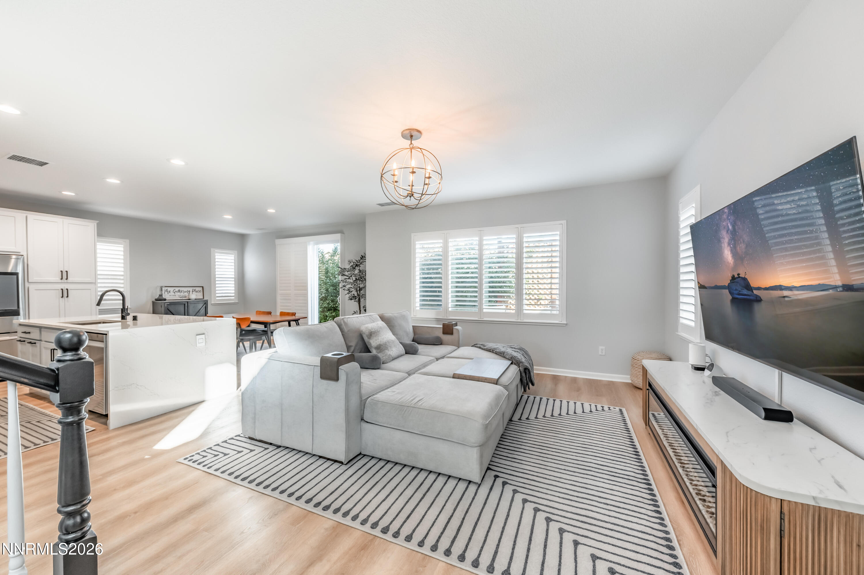 9530 Vikingholm Road Reno, NV 89521 - Photo 4 of 42 a living room with furniture a flat screen tv and a large window